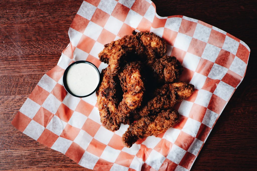 Fried chicken tenders with a dipping sauce from the Bottom Lounge kitchen